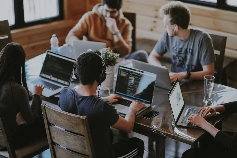 Diverse team collaborating on digital marketing strategy at Three Stripes Digital