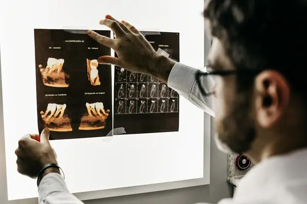 Dental professional with patient in modern treatment room